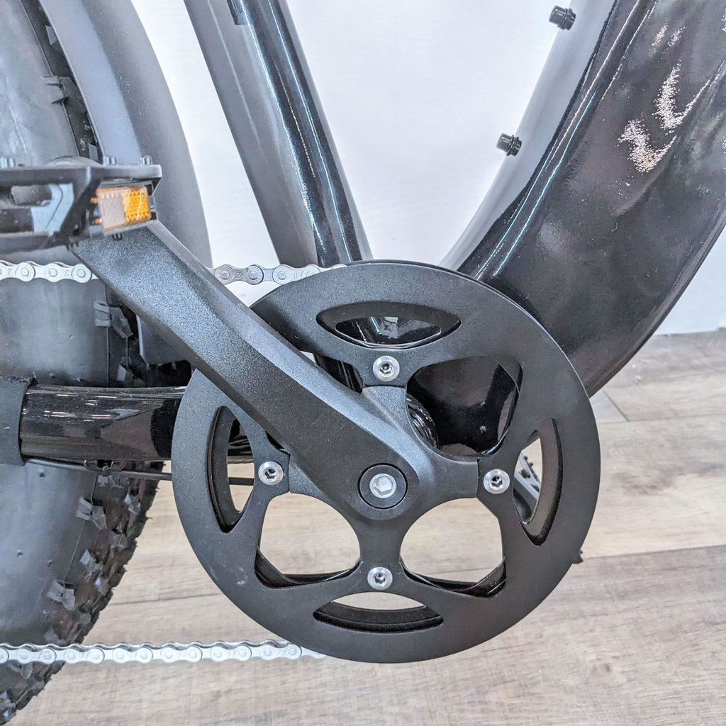 Close-up of the Aventon Aventure's pedal and chain area, highlighting a sturdy design.