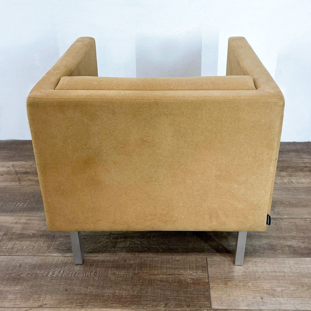 Modern Nienkamper lounge chair with streamlined design and metal legs.