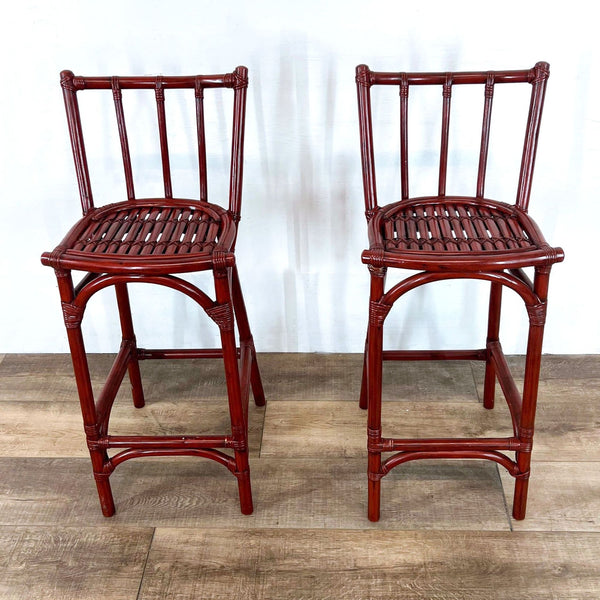 Pair of slat back bamboo stools with curved seats.