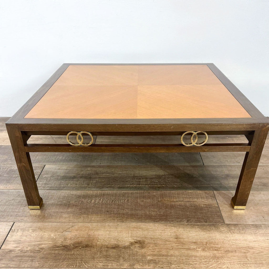 Wooden coffee table by Reperch, featuring brass accents and chevron top.  