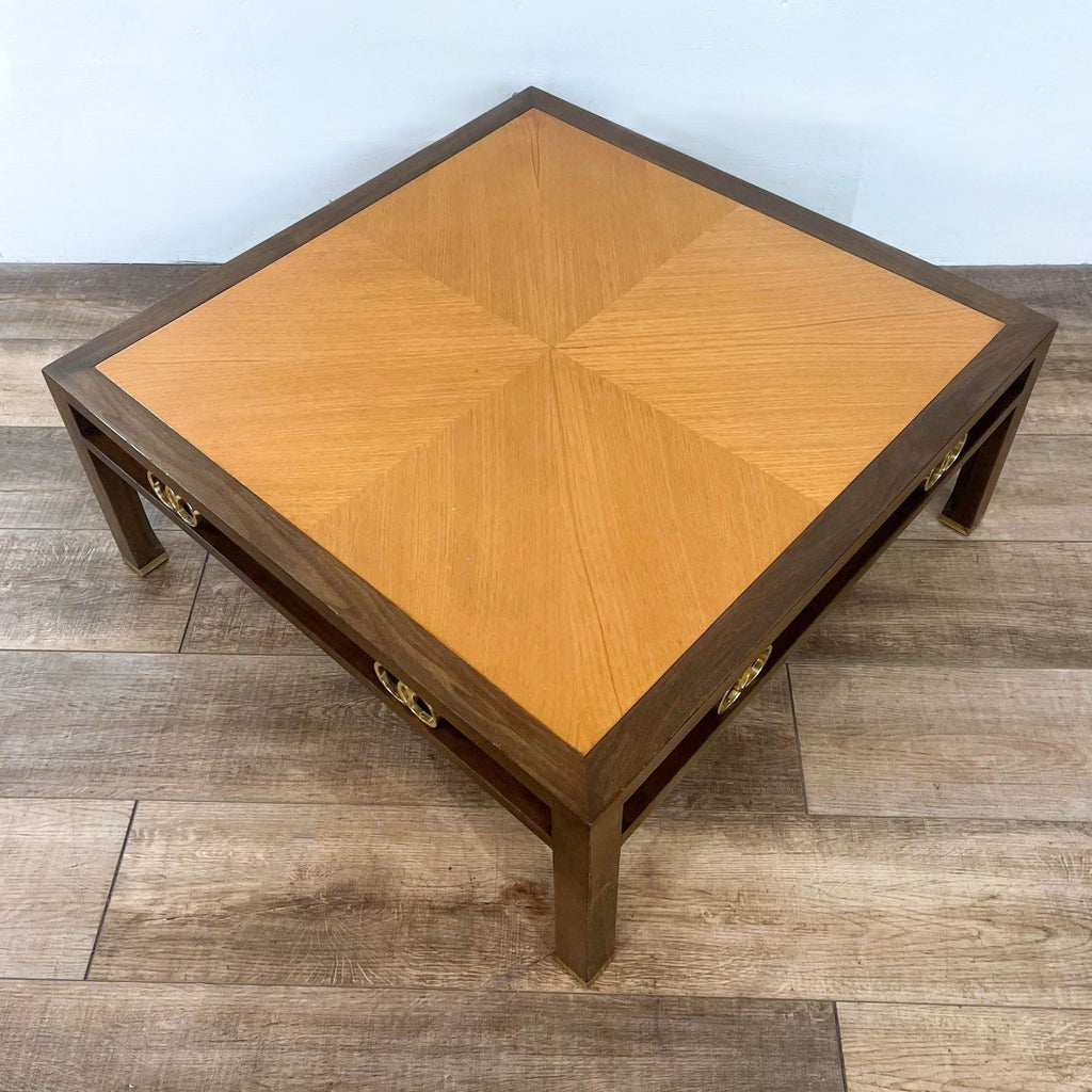 Elegant Reperch coffee table with brass embellishments and patterned top.  