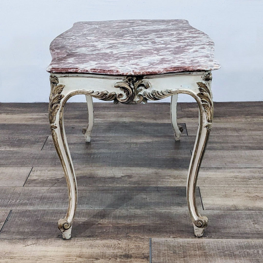 Elegant, painted console table with ornate carvings and marble surface. Brand: Reperch.