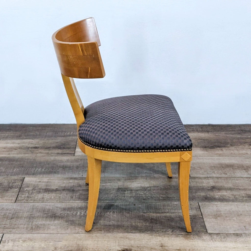 Side view of Randolph & Hein dining chair with nailhead trim.