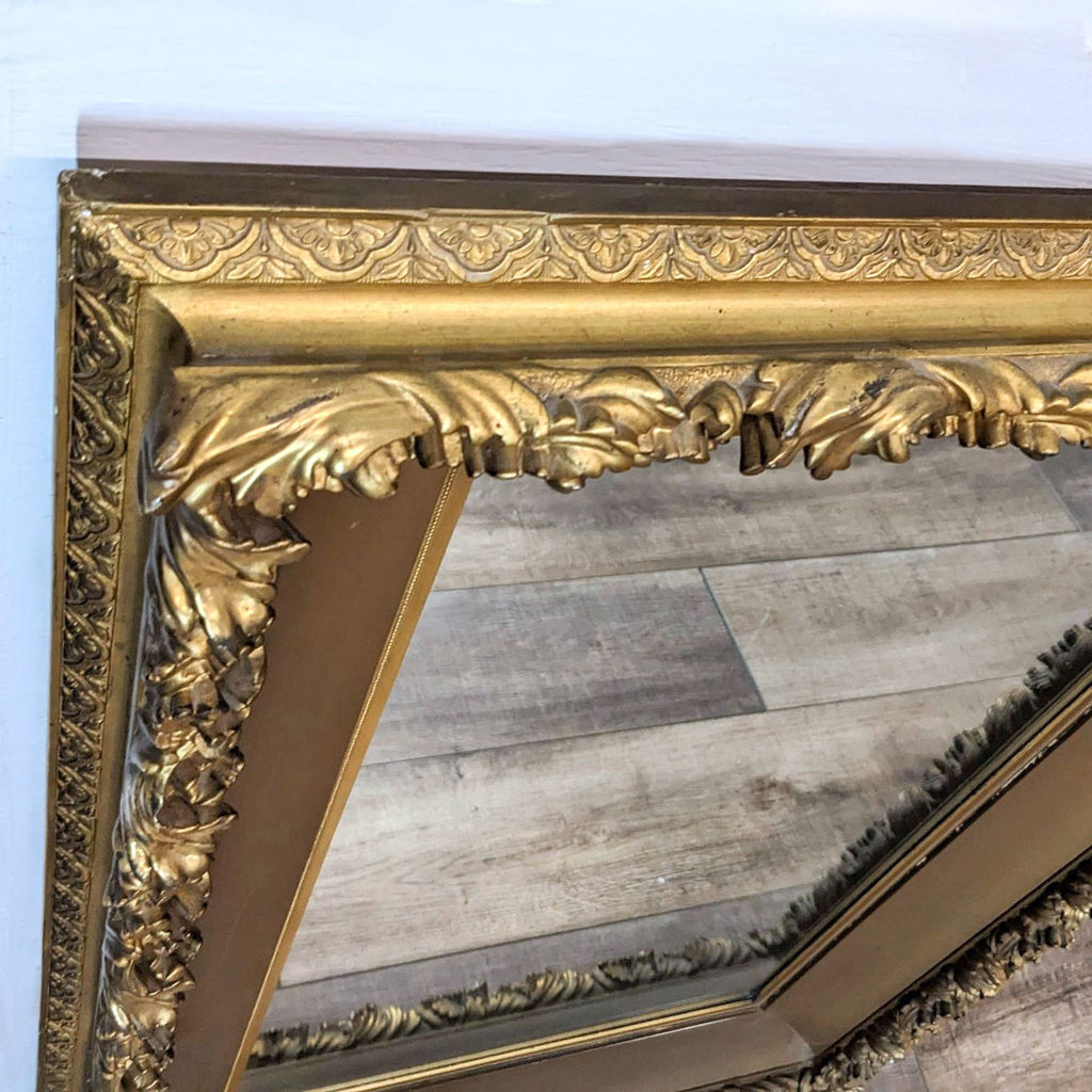 Close-up of Gump’s mirror with gold giltwood and carved design.