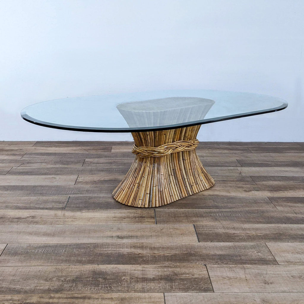Reperch dining table with clear glass top and bamboo sheaf-style base, showcasing intricate detailing.