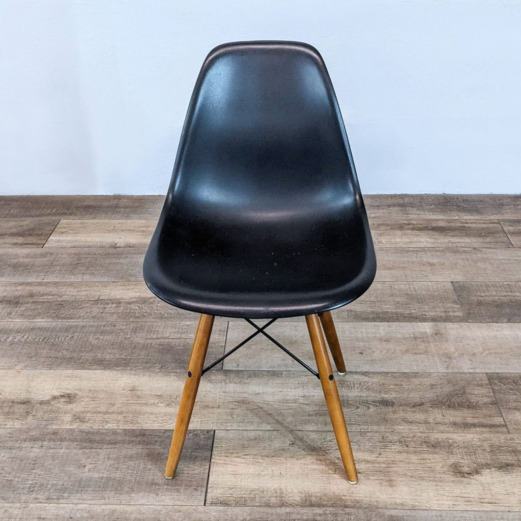 a vintage black leather [ unused0 ] chair with a black leather seat and legs.