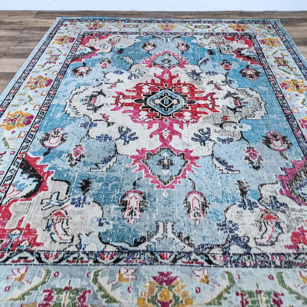 Colorful floral-patterned rug with blue and red accents.
