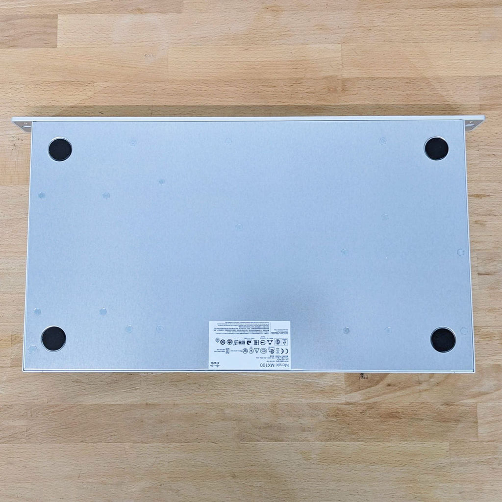 2. Bottom view of Cisco & Bros. network device revealing four rubber feet and a central product label sticker.