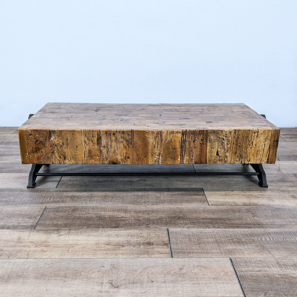 Retro industrial coffee table with butcher block style and decorative Paris cast iron base.