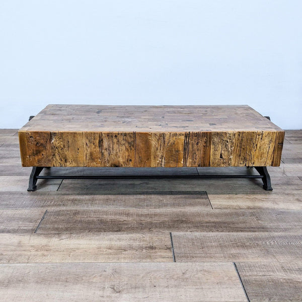 Retro industrial coffee table with butcher block style and decorative Paris cast iron base.