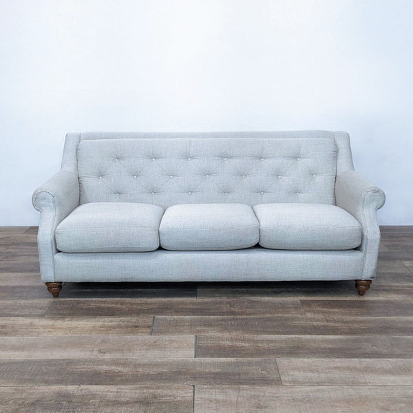 La-Z-Boy 3-seat sofa with tufted back, rolled arms, and spindle legs in light fabric.