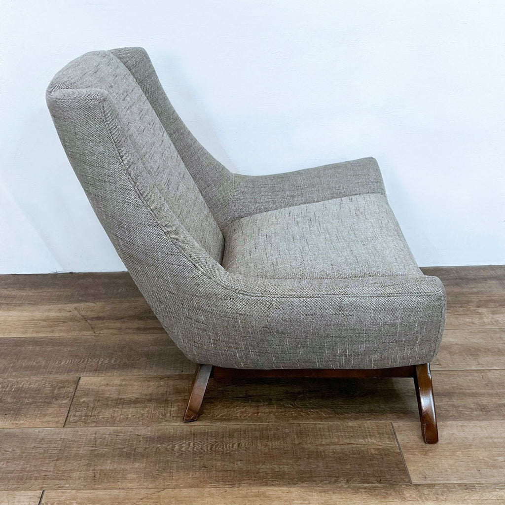 Jasper chair side profile showing sleek lines and beech wood leg.