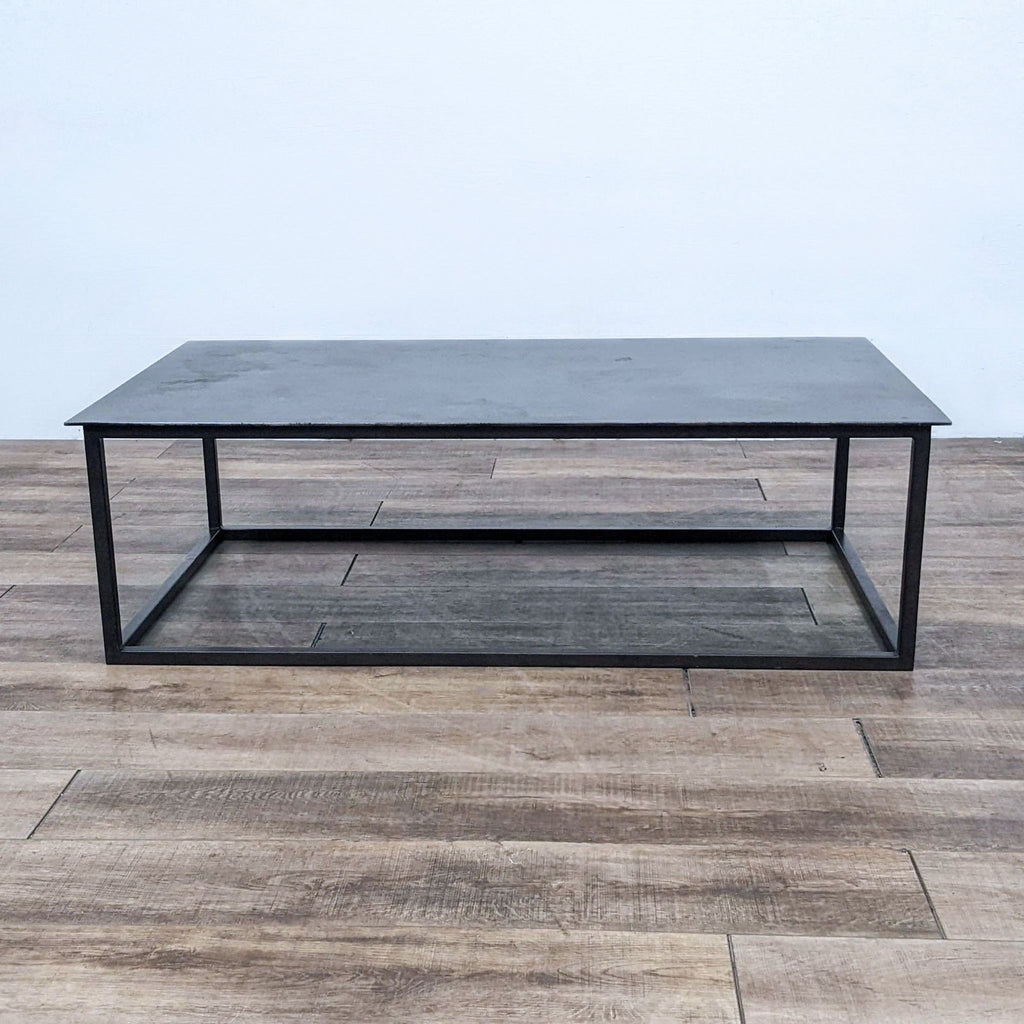Rectangular coffee table with sheet metal top and square-pipe legs.