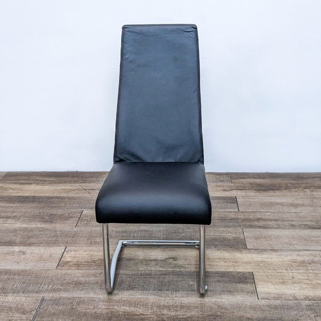Front view of a Euro Style dining chair featuring a black leatherette seat and high backrest.