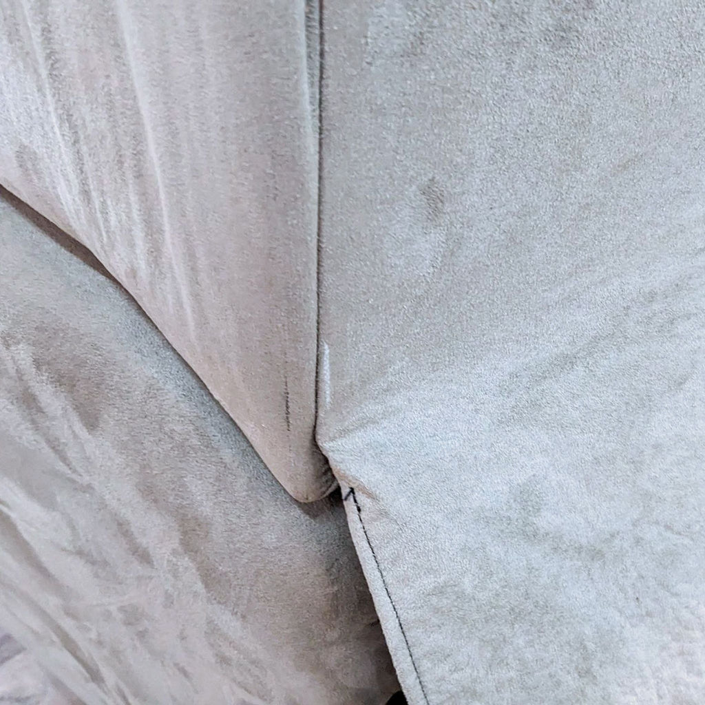 Close-up of the fabric texture on a La-Z-Boy recliner chair.