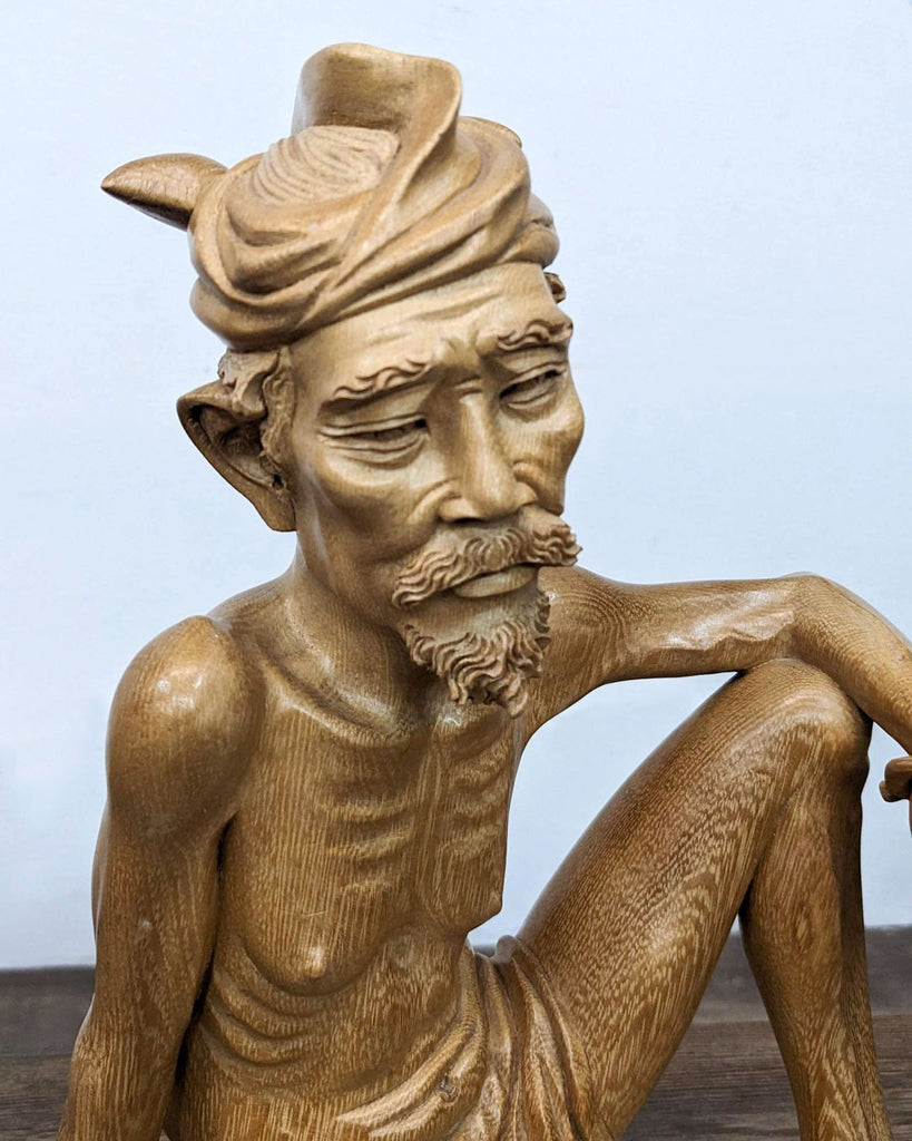 a statue of a man with a hat on 