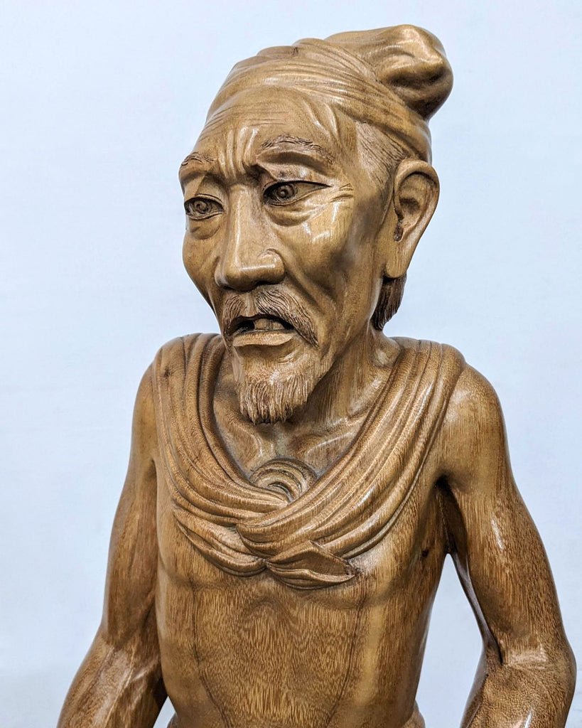 a statue of a man in a suit 