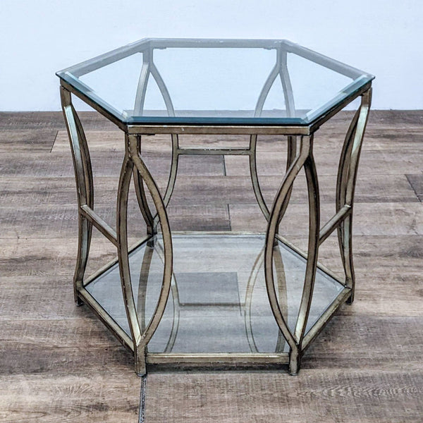 1. Hexagonal glass end table by Z Gallerie with metallic gold frame and modern openwork design, shown on wood floor.