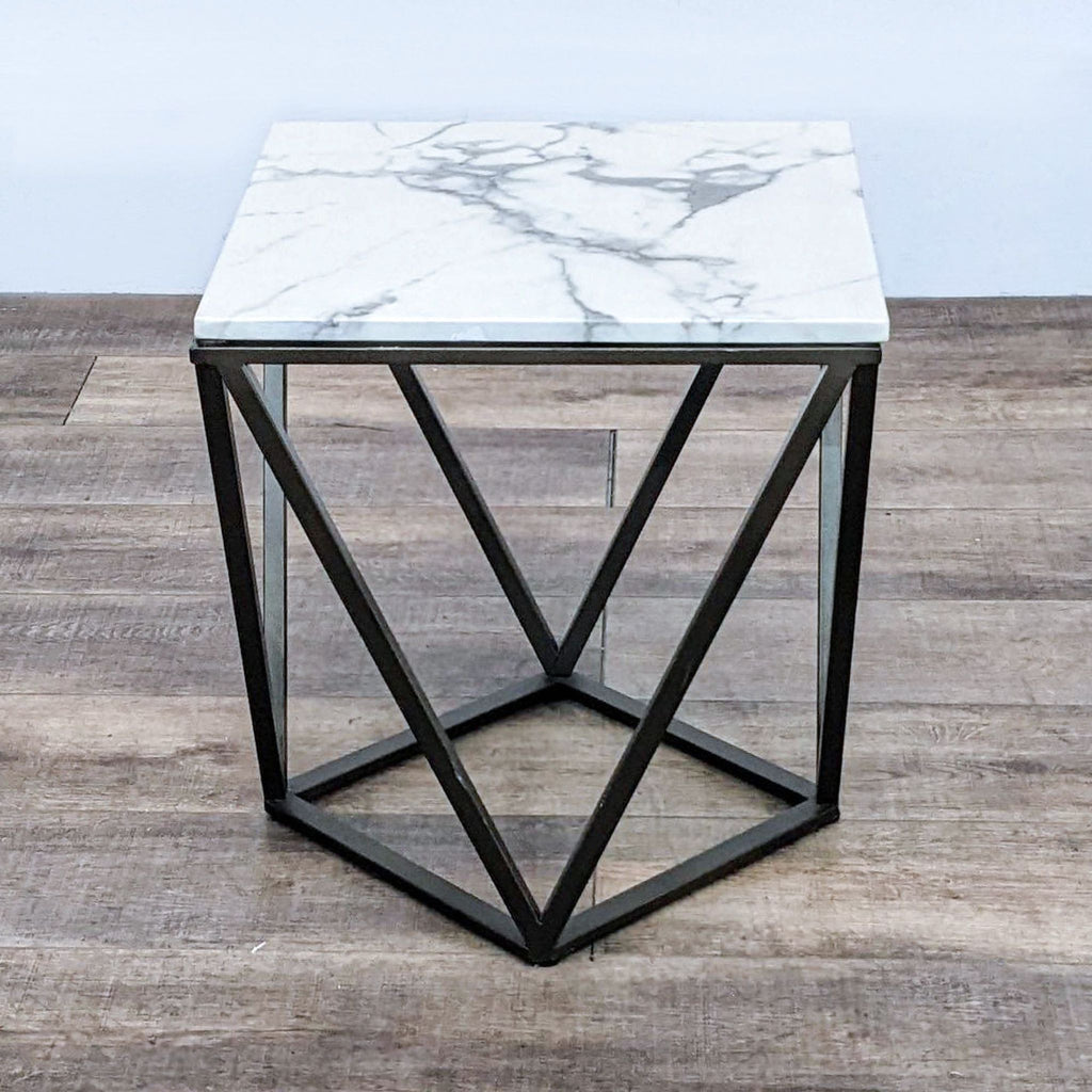 Stylish end table featuring faux marble and metallic design.