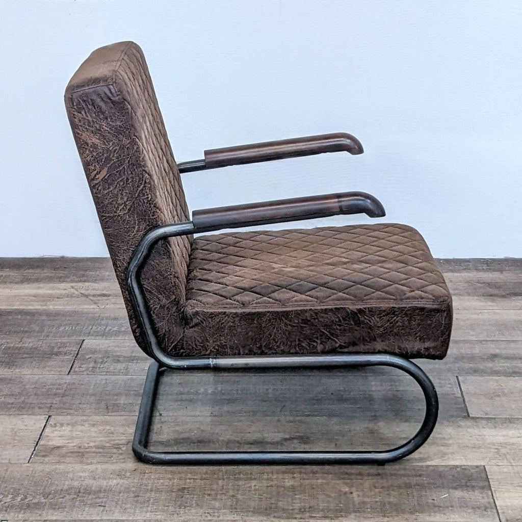 Side view of a cantilever-style lounge chair with brown quilted upholstery and black frame.