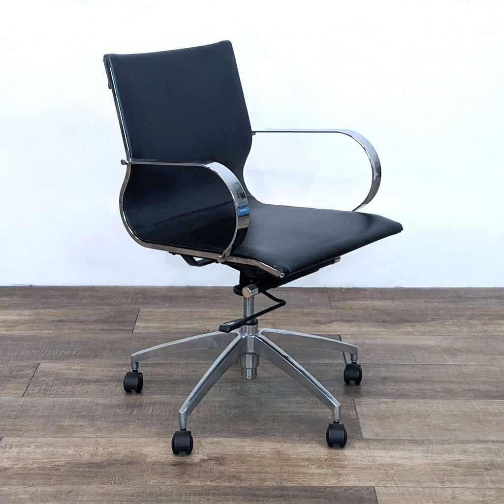 Side view of an office chair with black polyurethane upholstery and chrome accents.