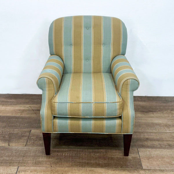 Front view of striped armchair with rolled arms and wood feet.