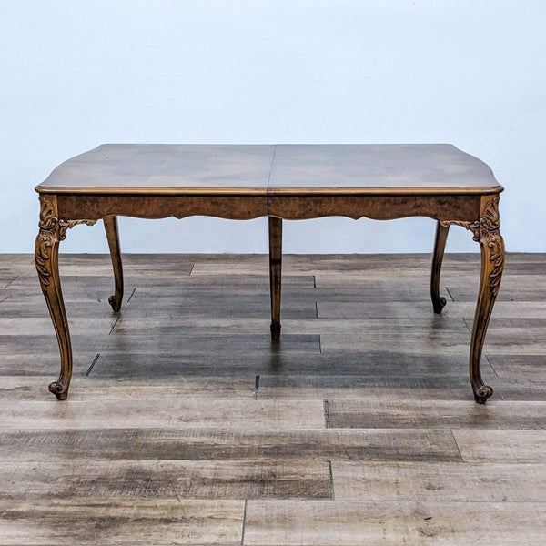 Reperch antique dining set with an extendable carved table and elegant detailing.