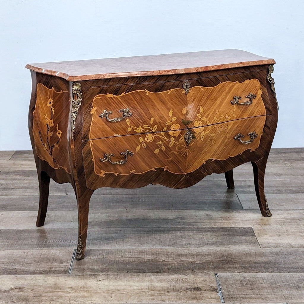 Elegant two-drawer French commode, wood inlay, pink marble top, brass accents, Reperch brand dresser.