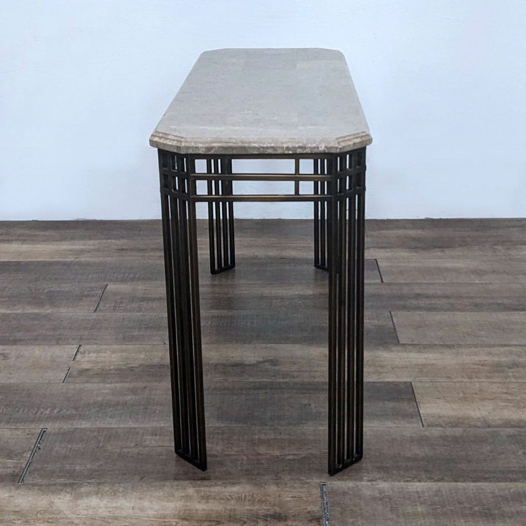 Side view of Reperch console table showcasing marble and metal features.