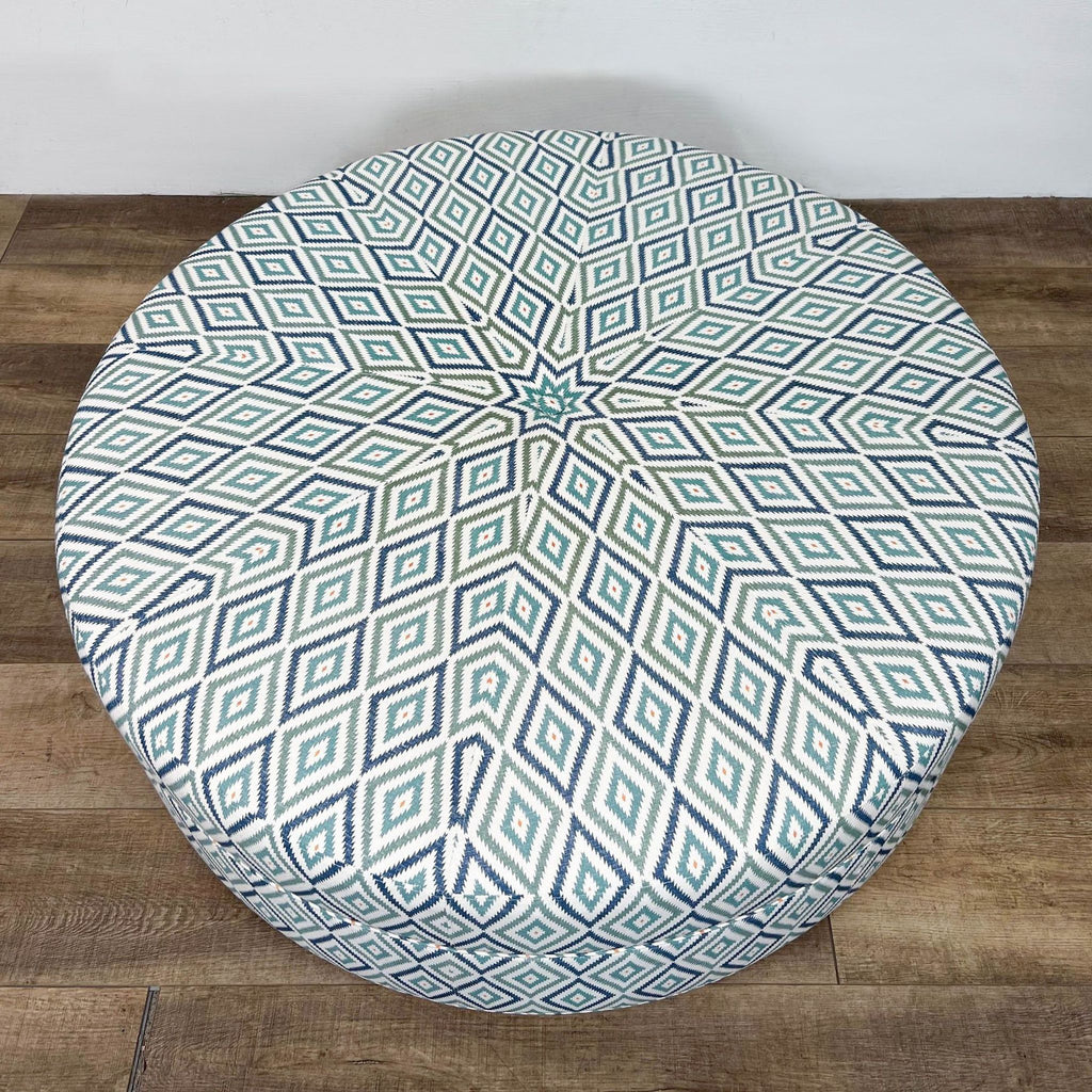 Modern patterned fabric ottoman, ideal as coffee table or seating.