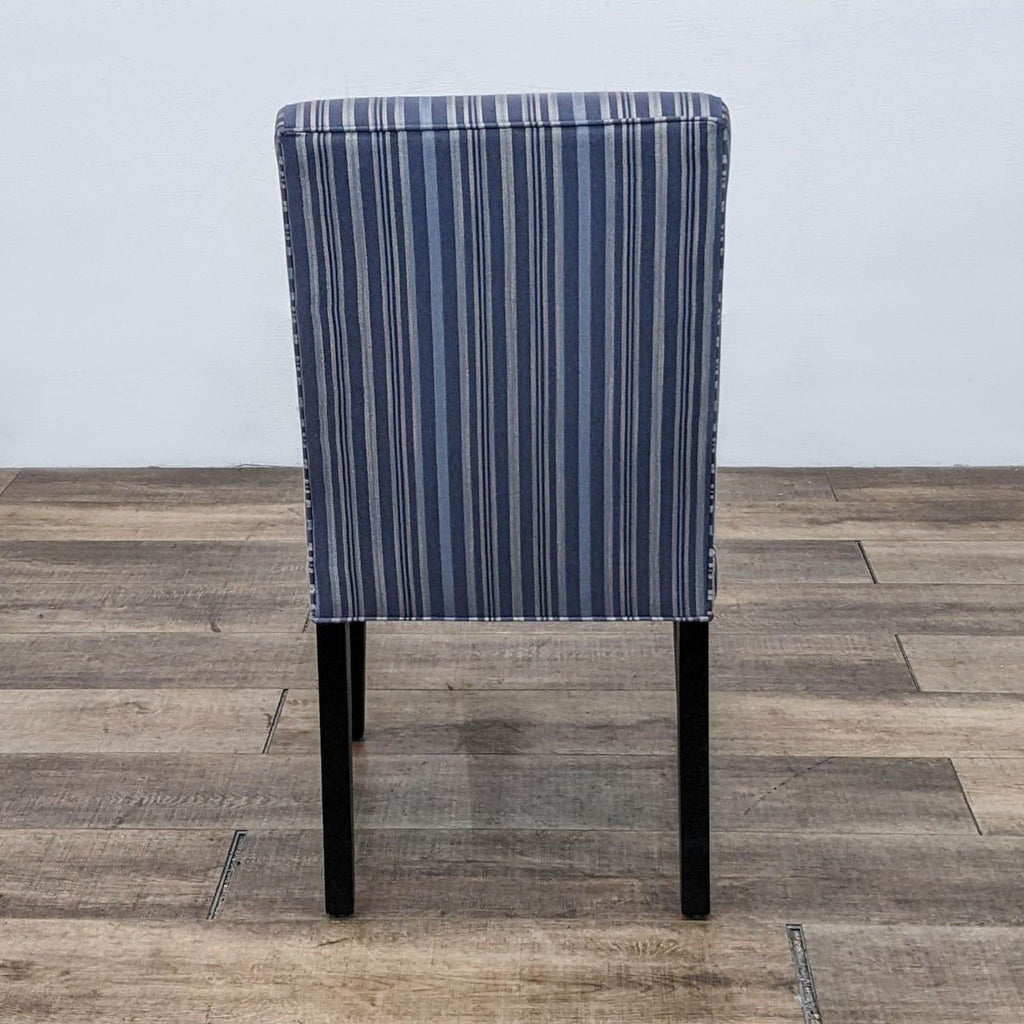 Single upholstered chair with striped fabric from the Reperch dining set.