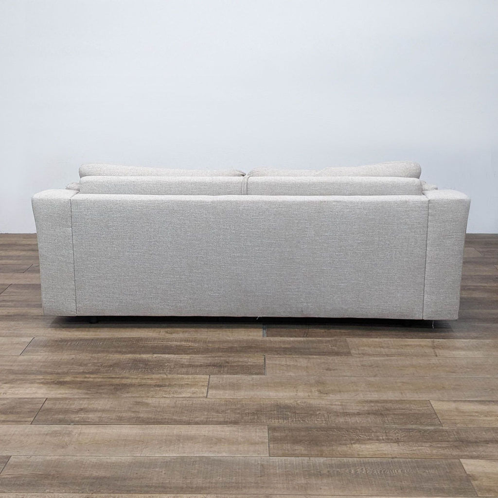 Back view of the grey sleeper sofa, from Living Spaces.