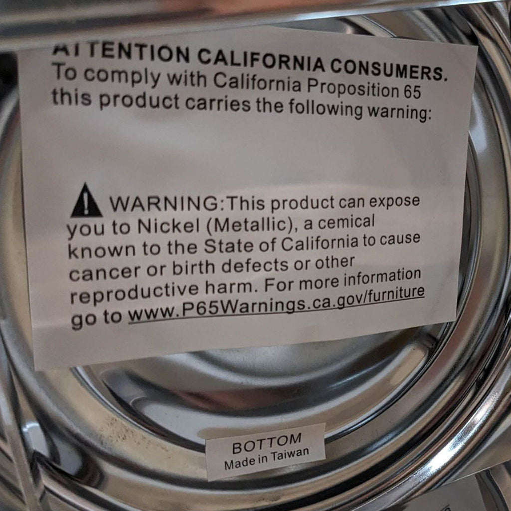 Close-up of California Proposition 65 warning label on Reperch stool.
