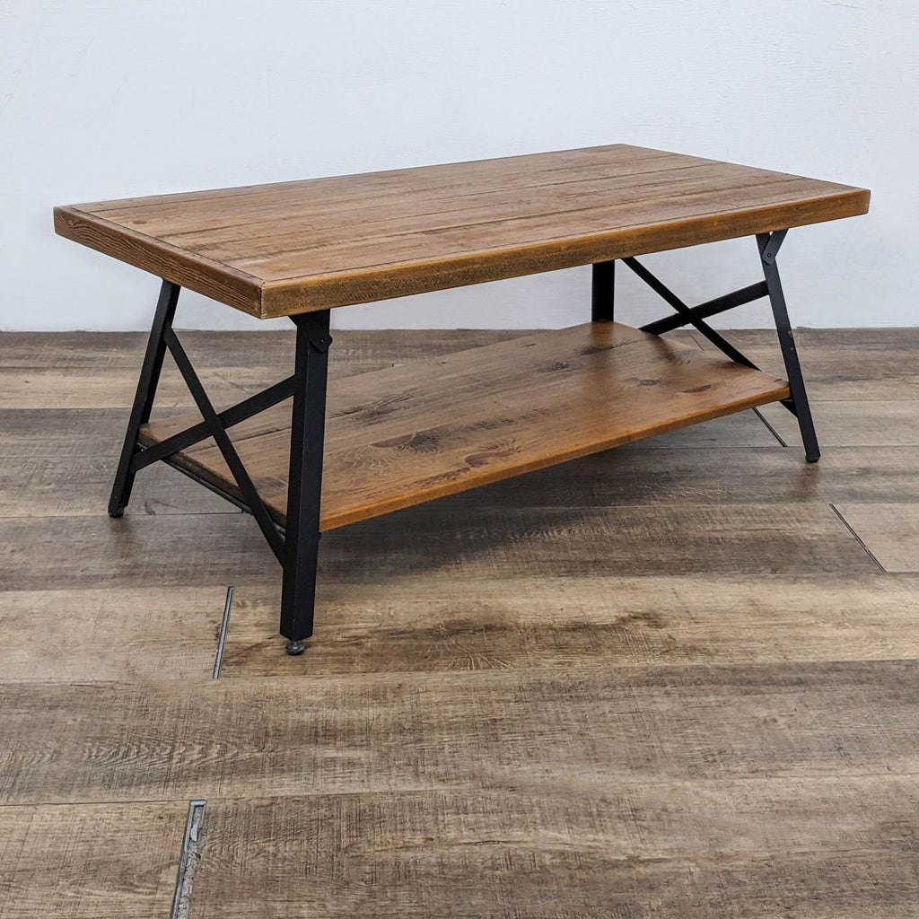 Side view of Reperch table highlighting steel frame and lower pine shelf.