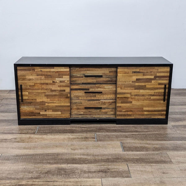 Front view of Crate & Barrel entertainment center with wood sliding doors and drawers.