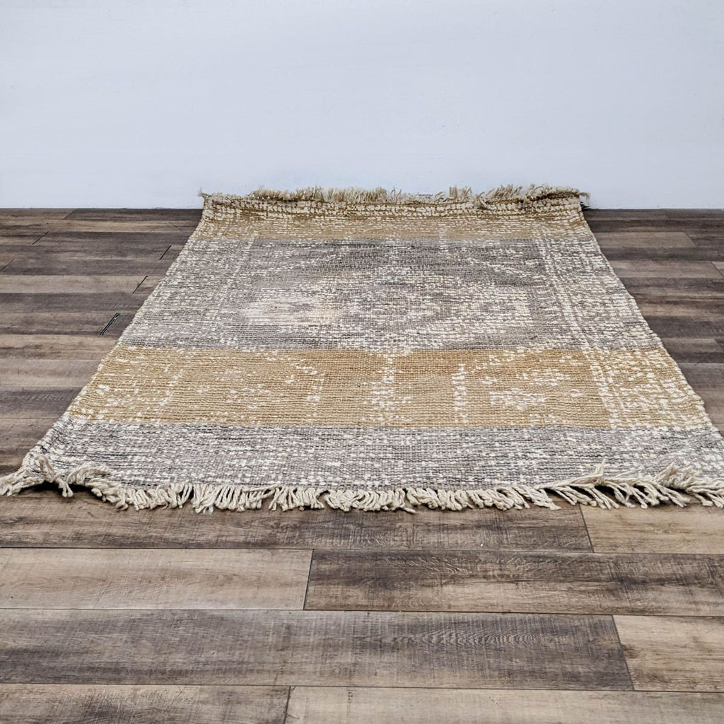 World Market Dehra Jute rug with a textured pattern and fringe.