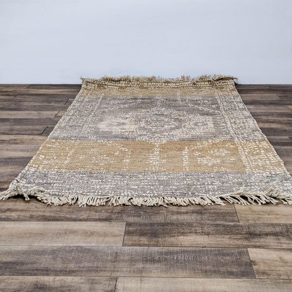 World Market Dehra Jute rug with a textured pattern and fringe.