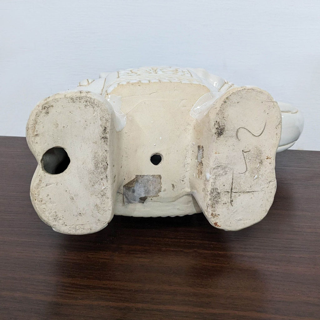 Bottom view of the Reperch porcelain elephant sculpture.