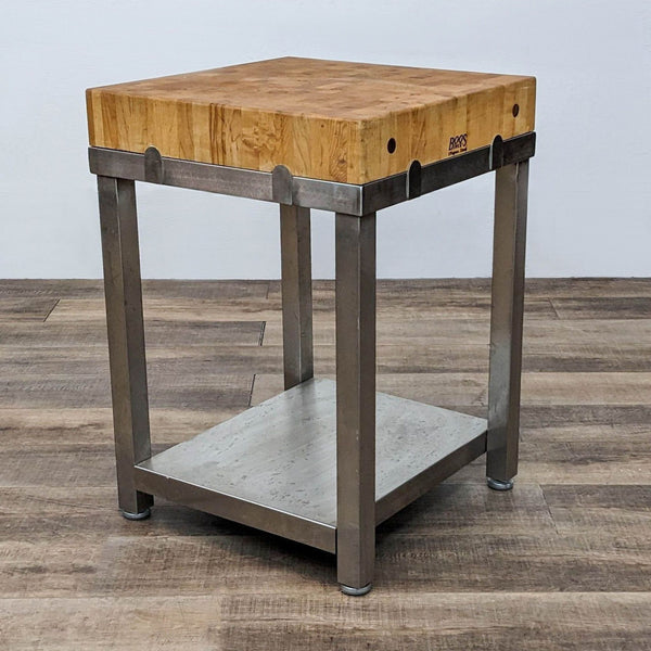 Boos Block butcher block island on stainless steel base with shelf.