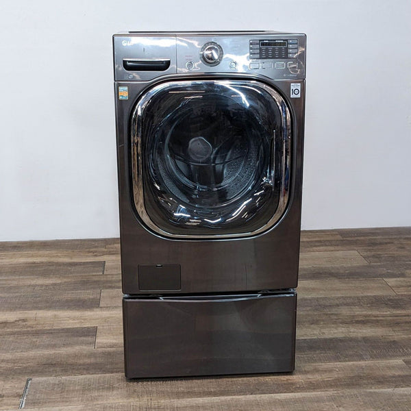 Front view of LG washer/dryer with closed door, stainless steel finish.