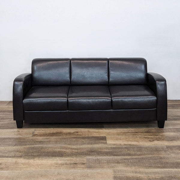 a couch with a black leather couch cushion 