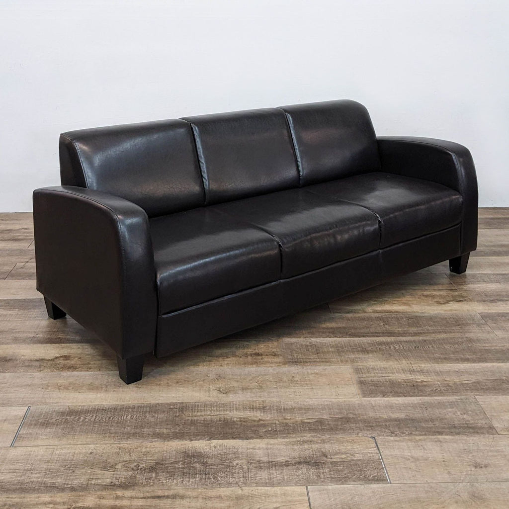 a black leather couch with a black leather seat 