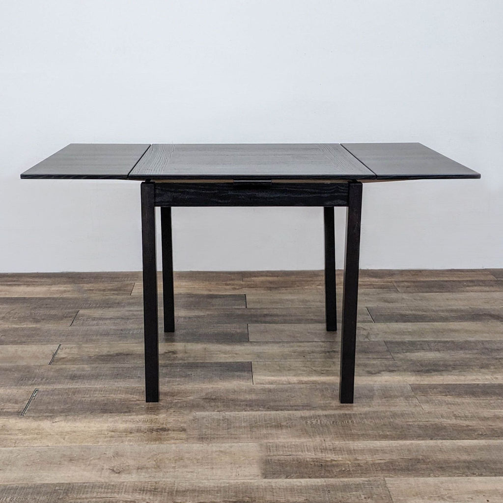 Hammel Furniture dining table with expandable leaves, square shape, and simple straight legs design.