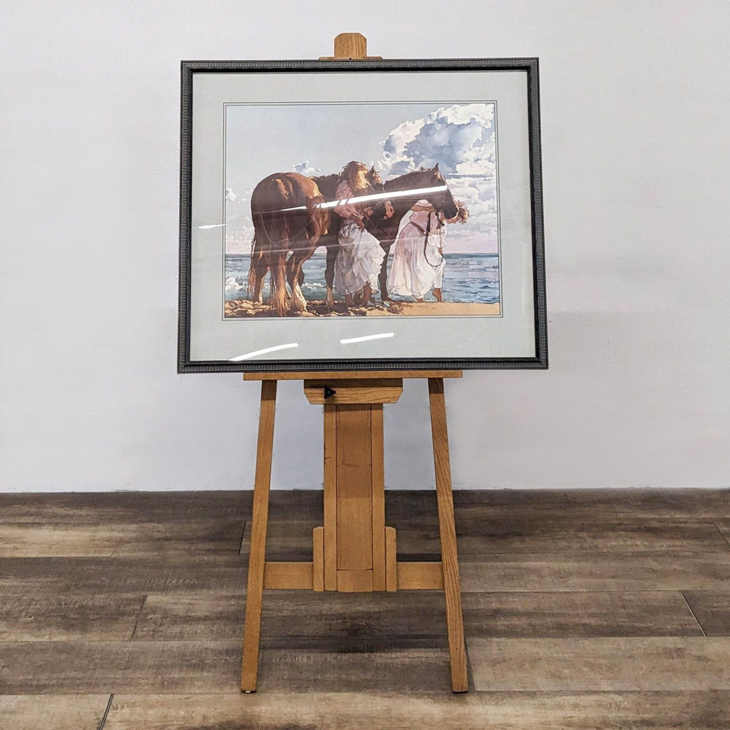 Framed print on easel showing two people with horses by the sea. Brand: Reperch.