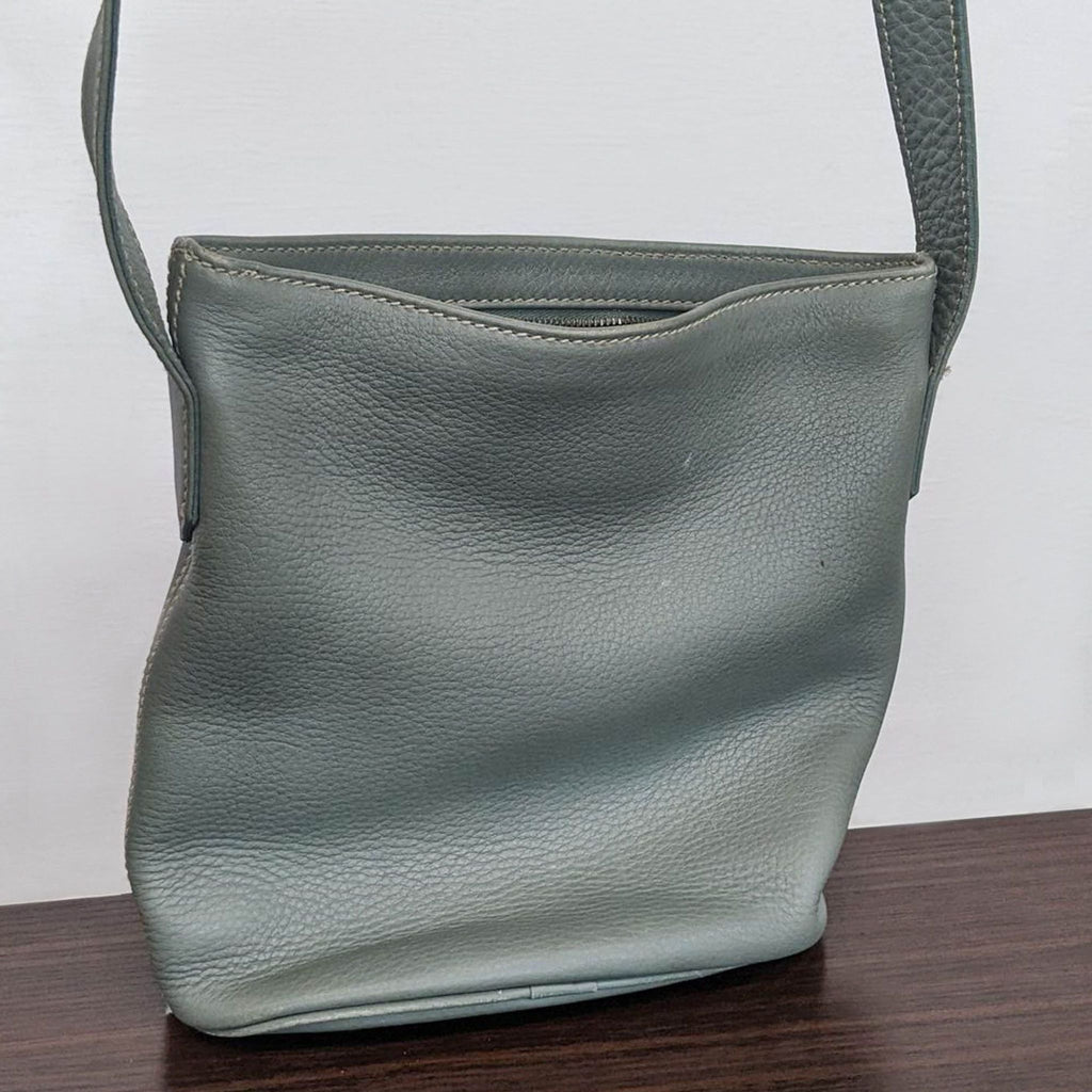 Coach purse with a simple design and textured leather.