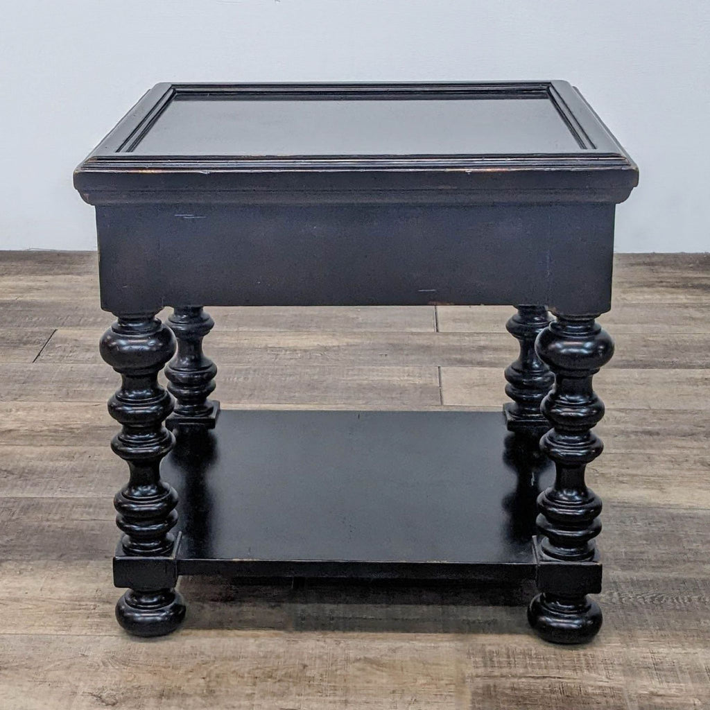 2. Lexington Kingstown Explorer end table in a distressed black wood, with shelf and ornate spindle legs.