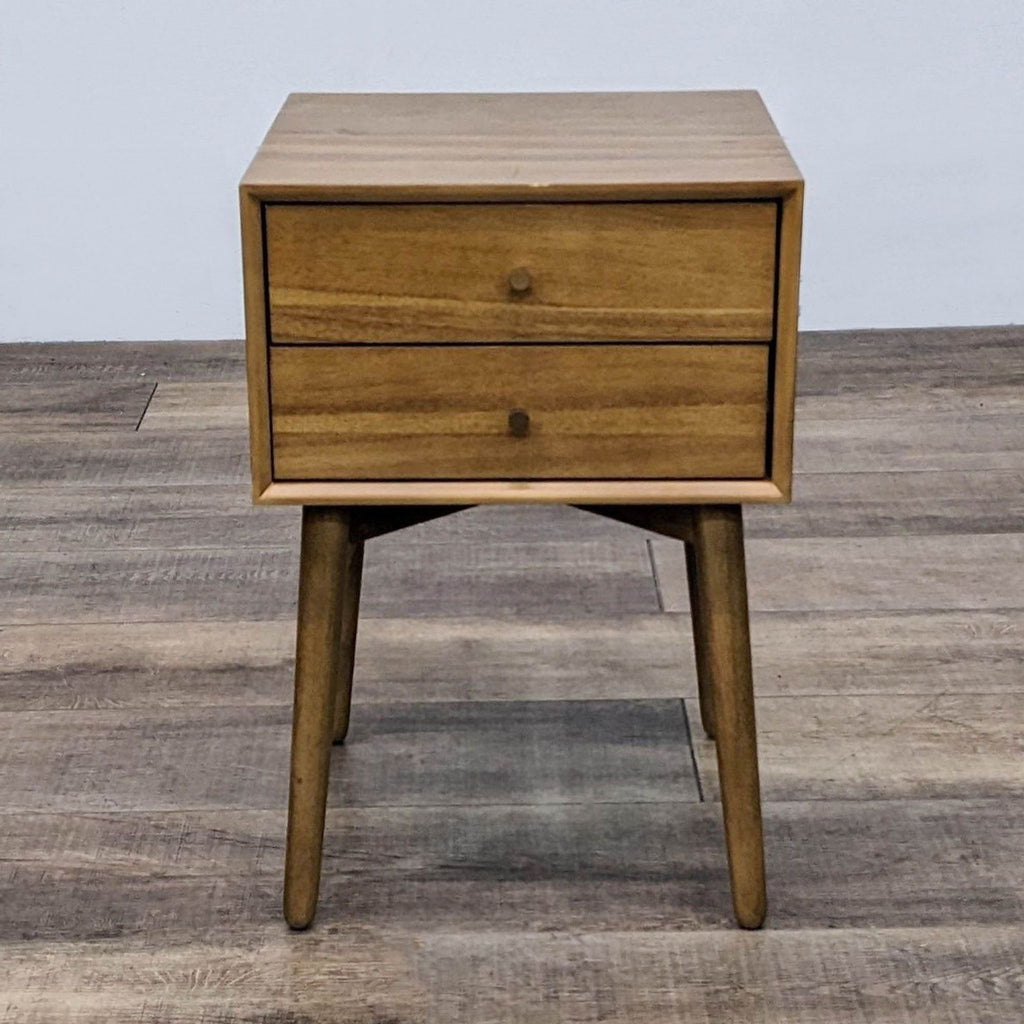 Reperch End Table with two drawers on tapered legs, displayed on wooden floor.