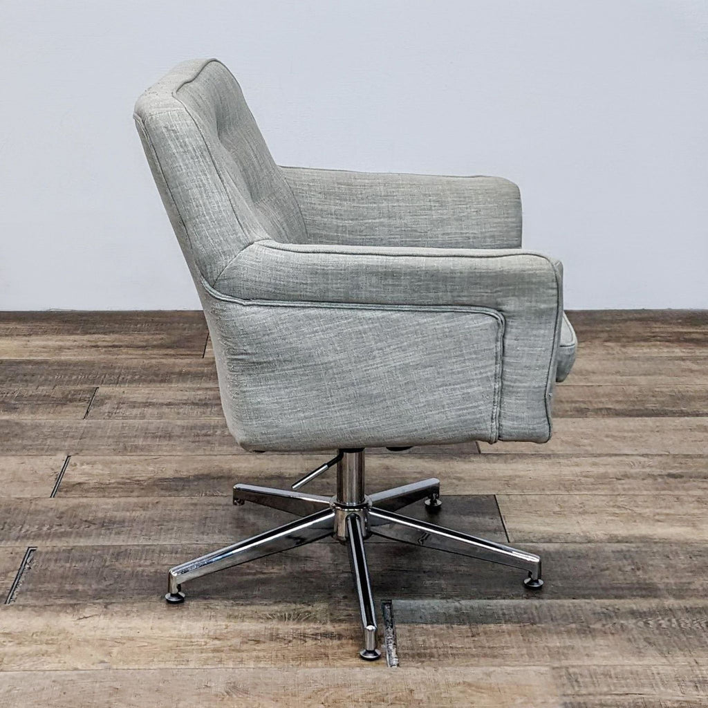 Side view of a Reperch chair with textured linen and adjustable chrome base.