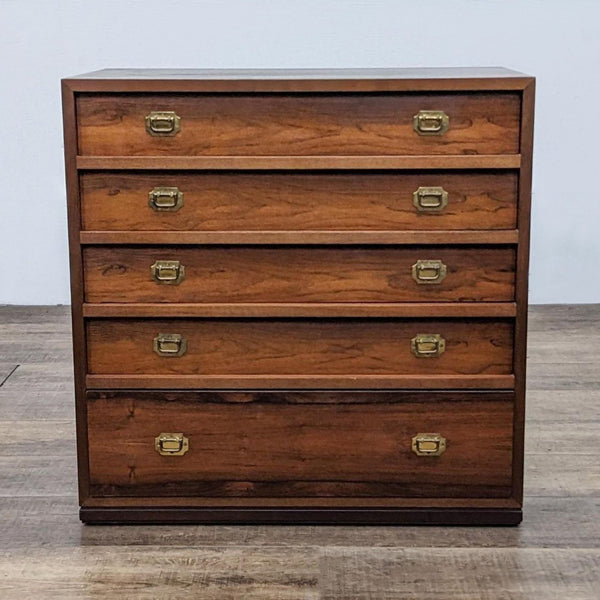 Wooden side table with five drawers and brass handles.