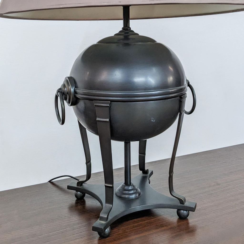 Close-up of a Reperch lamp's metal base with unique ring design.